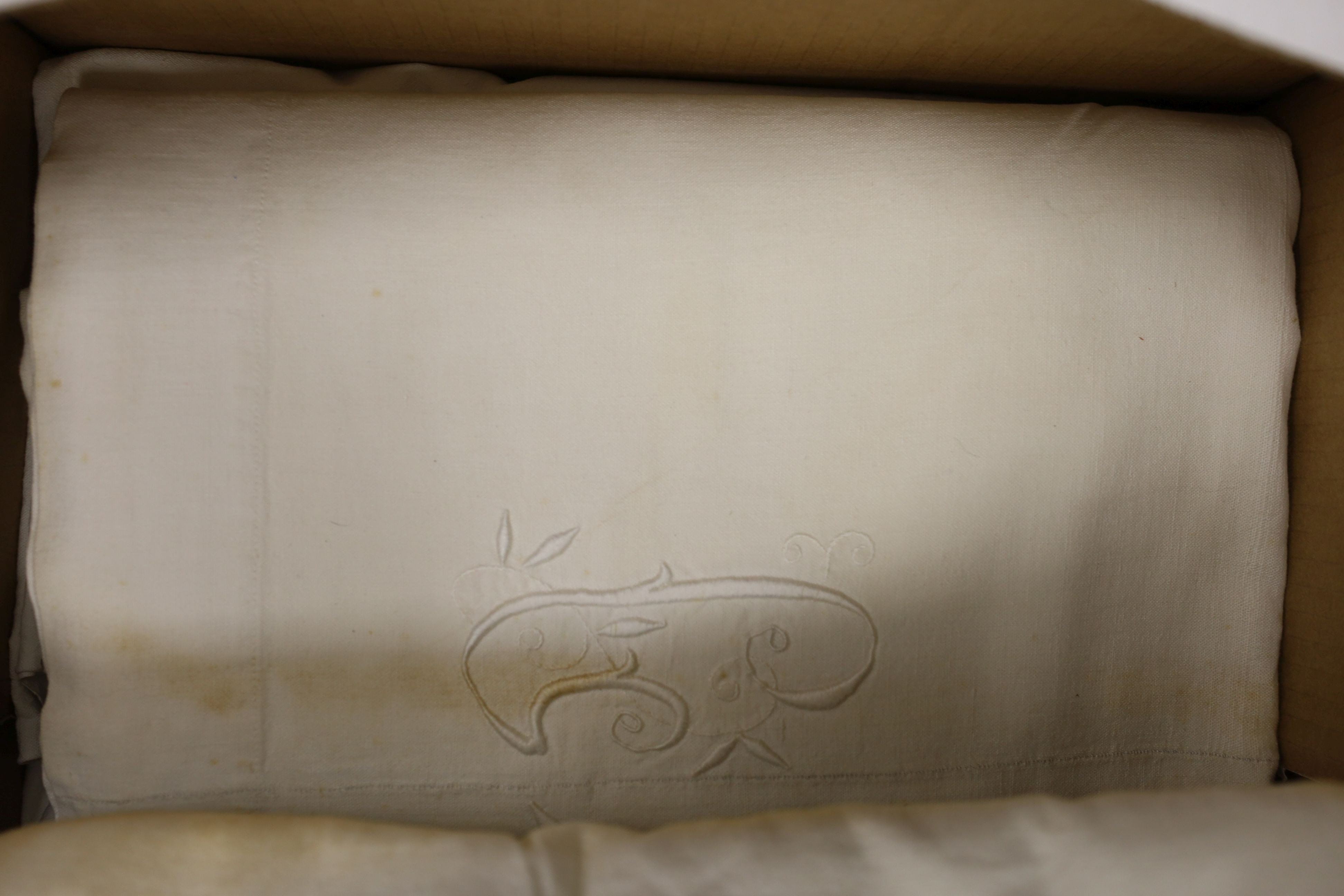 Twelve French provisional coarse linen sheets with embroidery.